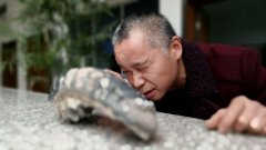 铜梁一面粉厂改建挖出一颗长29厘米重四斤的牙齿